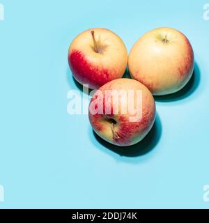 Apples on blue background art image Stock Photo