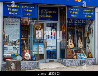 a high street musical instrument store or shop selling a variety of music making guitars and various instruments. Stock Photo