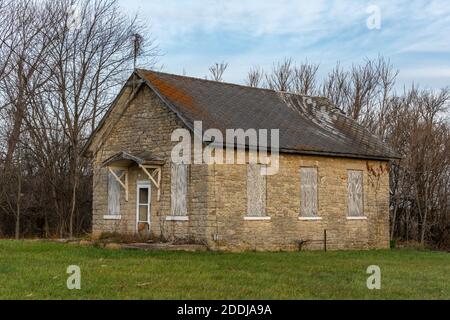 Old abandoned stone one room schoolhouse in the morning light.  Trivoli, Illinois. Stock Photo