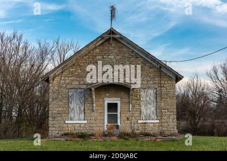 Old abandoned stone one room schoolhouse in the morning light.  Trivoli, Illinois. Stock Photo
