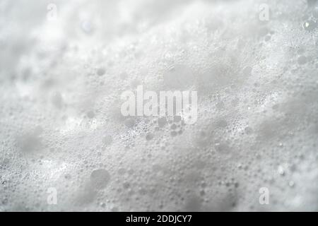 Foam bubbles from soap or shampoo, top view macro photography. Stock Photo