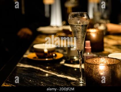 A glass of prosecco sits on the table Stock Photo