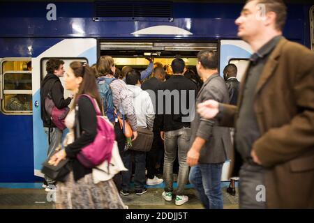 Commuters try to get in a RER train at Gare Du Nord station in Paris, France on September 13, 2019. A one-day strike of Paris public transports operator RATP employees is called by unions over French government's plan to overhaul the country's retirement system. Ten of the city's 16 metro lines were shut down completely, while service on most others was 'extremely disrupted,' the RATP transit operator said. The city's burgeoning cycle lane system was seeing a surge in traffic as people pulled out bikes to get to work. Photo by Rafael Lafargue/ABACAPRESS.COM Stock Photo