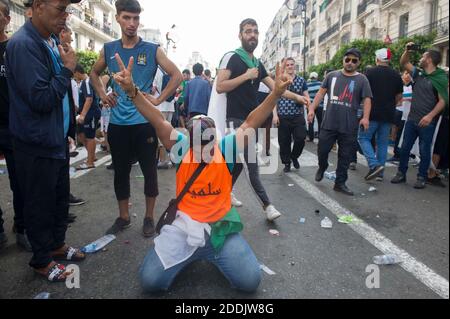 20th Friday of Protest in Algiers, Algeria, on July 05, 2019. Algerian protesters clash with riot police during a weekly demonstration coinciding with the Algerian Independence Day at the capital streets. Algerians took to the streets to mark the day which falls this year on Friday that had witnessed their weekly protests against figures of the former regime since the departure of former president Abdelaziz Bouteflika in April and also Algeria marks its Independence Day to commemorate independence from France on the 5th of july 1962. Thousands of people demonstrated for the twentieth consecuti Stock Photo