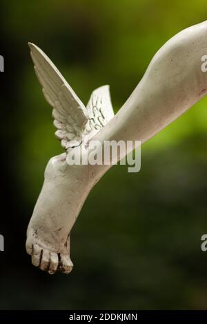 Reproduction of the Foot next to the Greek god Hermes or Mercury - God of Comerce - according to Roman mythology. Stock Photo