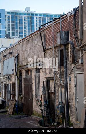old and rustic street in the middle of a modern city Stock Photo
