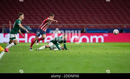 Madrid, Spain. 25th Nov, 2020. Atletico Madrid's Marcos Llorente (C) competes during the UEFA Champions League Group A football match between Atletico Madrid and Lokomotiv Moskva in Madrid, Spain, Nov. 25, 2020. Credit: Meng Dingbo/Xinhua/Alamy Live News Stock Photo
