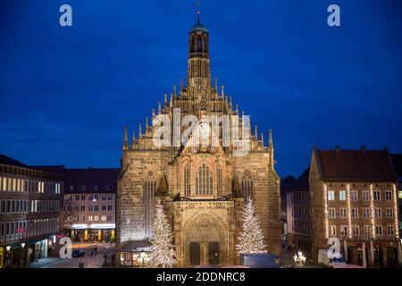 Nuremberg, Germany. 23rd Nov, 2020. View of the blue hour of the Frauenkirche from whose gallery the Nuremberg Christ Child officially opens the Nuremberg Christmas Market on the main market square in front of it every year. The world-famous Nuremberg Christkindlesmarkt, which was originally scheduled to open on 27.11.2020, is cancelled this year due to the Corona Pandemic. Credit: Daniel Karmann/dpa/Alamy Live News Stock Photo