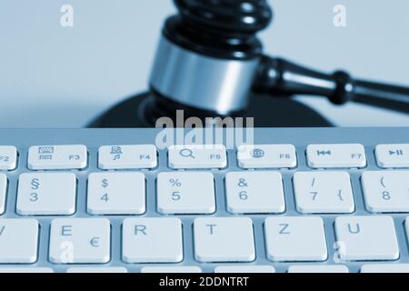 A computer and judge's gavel or auction gavel Stock Photo