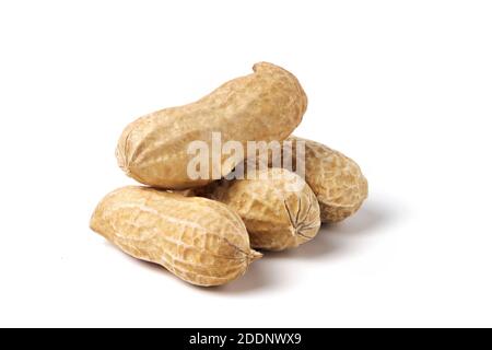 Raw peanuts isolated on white. Heap of groundnuts in a nutshell Stock Photo