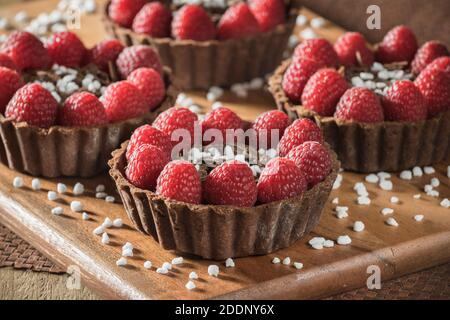 Chocolate and raspberry tarts Stock Photo