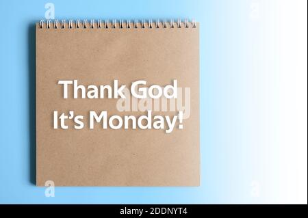 Thank God It’s Monday - text written ofl font on the craft paper of notebook. start of working weekday concept Stock Photo