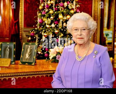Undated file photo of Queen Elizabeth II in the State Dining Room of Buckingham Palace, London, after recording her Christmas Day television broadcast to the Commonwealth for 2014.The Queen's royal Christmas will be a very different affair this year. Traditionally, the royal family descend en masse to the Sandringham estate for a festive stay with the monarch. But, like the rest of the nation, the Queen and her relatives will have to carefully chose who to have in their Christmas bubble, and where to stay. Stock Photo