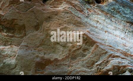 Sandy mountain wall background with relief Stock Photo