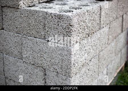 Cinder block bricks stacked on a pallet close up. Stock Photo