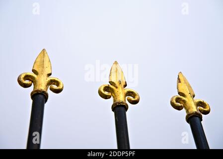Classic and ornate spiked security fence with golden spikes. . High quality photo