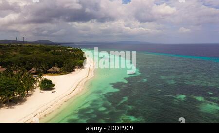 Aerial drone of coast, turquoise sea and sand beach. Panglao island, Bohol, Philippines. Stock Photo