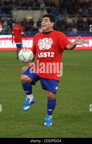 Rome, Italy - 12/10/2014: Diego Armando Maradona in action during the friendly match 'United for Peace' dedicated to Pope Francis at the Olympic stadium in Rome Stock Photo