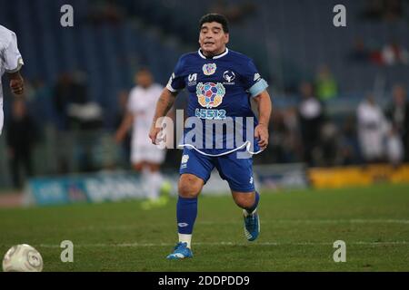 Rome, Italy - 12/10/2014: Diego Armando Maradona in action during the friendly match 'United for Peace' dedicated to Pope Francis at the Olympic stadium in Rome Stock Photo