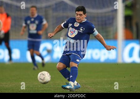 Rome, Italy - 12/10/2014: Diego Armando Maradona in action during the friendly match 'United for Peace' dedicated to Pope Francis at the Olympic stadium in Rome Stock Photo