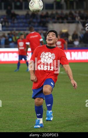 Rome, Italy - 12/10/2014: Diego Armando Maradona in action during the friendly match 'United for Peace' dedicated to Pope Francis at the Olympic stadium in Rome Stock Photo