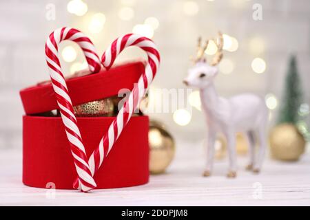 Christmas red gift box Decoration with Candy Canes hearts on gold bokeh buckground Stock Photo