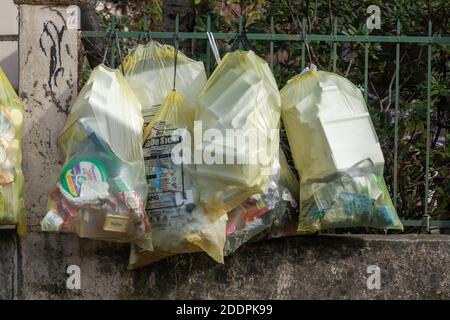 Yellow bags full of plastic waste Stock Photo - Alamy