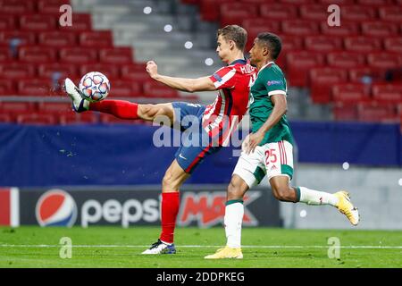 Marcos Llorente of Atletico de Madrid and Francois Kamano of Lokomotiv in action during the UEFA Champions League, Group A foot / LM Stock Photo