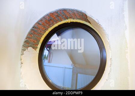 Construction PU foam in the window is installed using a mounting installation foam Stock Photo