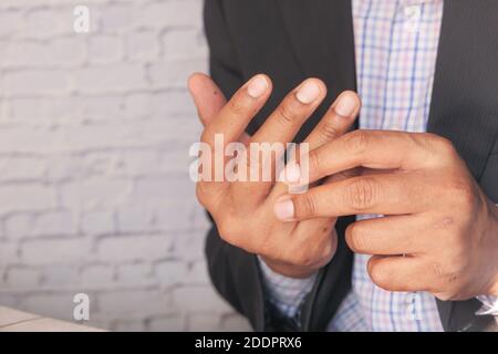 man suffering pain in hand close up  Stock Photo