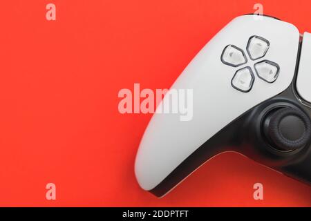 Video games white gaming controller isolated on red color background top view Stock Photo