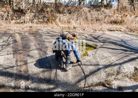 Korean hikers climbing the rock at the Bukhansan Mountain National park in Soeul, South Korea. Stock Photo