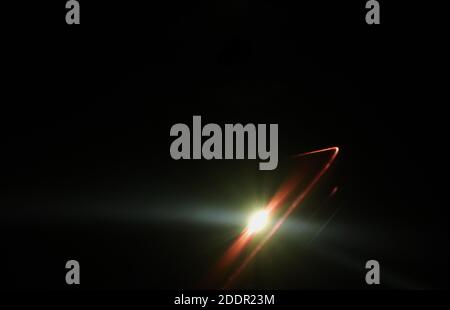 flashlight of mobile phone in dark night Stock Photo