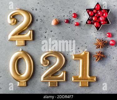 Date 2021 in the form of Golden candles. New year's card, 2021. Stock Photo