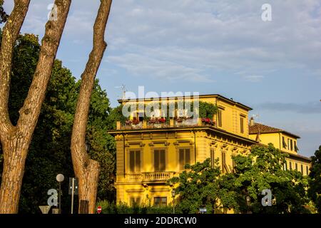 Lucca, Italy - July 9, 2017: View a Penthouse with Flowers on a Sunny Day Stock Photo