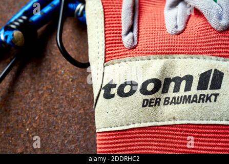 Toom DIY store gloves with the trademark and logo of the DIY chain, close-up of used work gloves in Gifhorn, Germany, November 17, 2020 Stock Photo