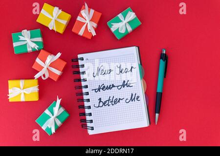 New year, better me. Happy new year quote. Red background.Top view. Flat lay Stock Photo