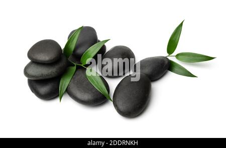 massage stones isolated on white background with green leaf. lastone therapy Stock Photo