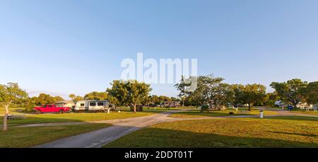 Flamingo Campground; motorhomes, grassy campsites, many empty, trees, golden hour light, recreation, Florida; Everglades National Park; Flamingo; FL; Stock Photo