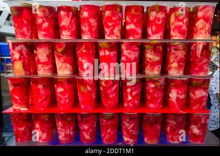 Traditional Turkish street food - canned pickled vegetables in brine. Red pickles on street food vendor close up on Eminonu square in Istanbul, Turkey Stock Photo