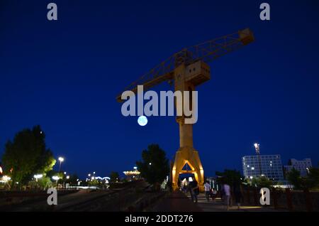Giant yellow crane in Nantes at night, France Stock Photo