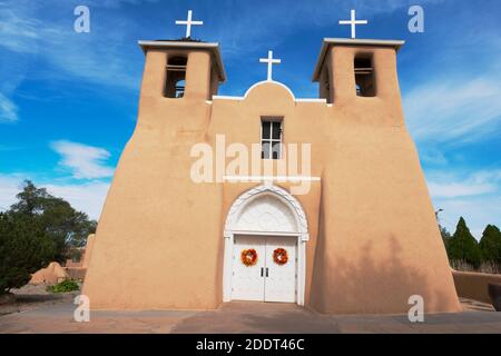 The adobe Mission church of San Francisco de Asis - St Francis of Assissi - in Ranchos de Taos, New Mexico, USA Stock Photo