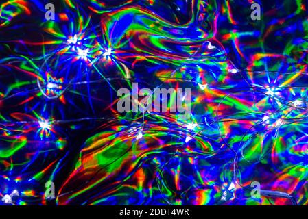 colorful holographic paper with rainbow lights. Stock Photo