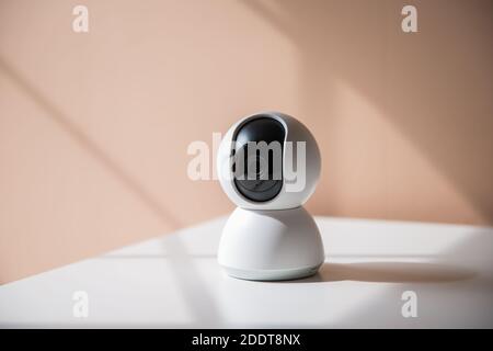 white video surveillance camera to monitor babies, children or areas of the house Stock Photo