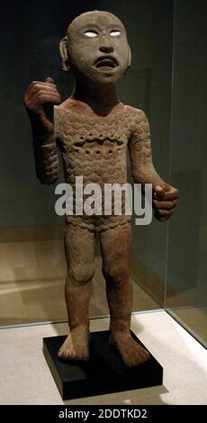 Statue depicting Xipe impersonator. Aztec. Last Postclassic Period (1350-1521). Volcanic stone, shell and paint. Area of Mexico City. Dallas Museum of Art. State of Texas. United States. Stock Photo