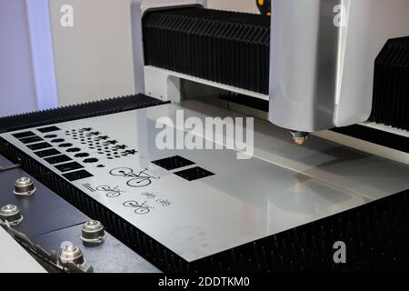 Automatic cnc laser cutting machine working with sheet metal Stock Photo
