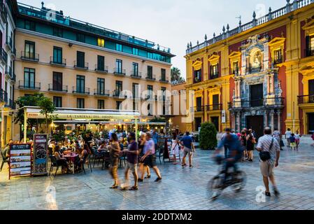 Bars and terraces in the lively Plaza del Obispo - Bishop's Square, at dusk. Málaga, Andalucia, Spain, Europe Stock Photo