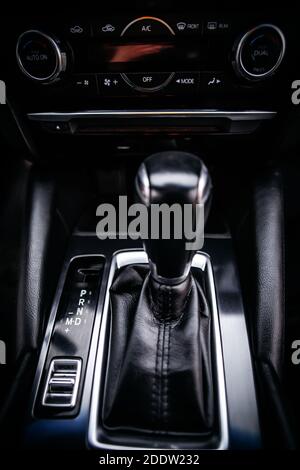 The gear shift lever in the modern car, close up shot of gearshift Stock Photo