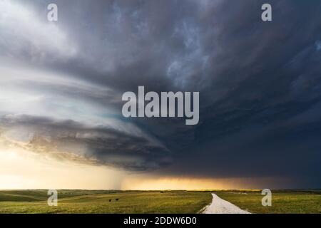 Dark storm clouds from a supercell thunderstorm over a scenic landscape in Nebraska. Stock Photo