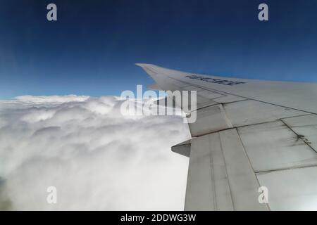 Shanghai, China. 30th May, 2019. Wing of the plane that just took off from the Shanghai Pudong International Airport (PVG) in China. Stock Photo